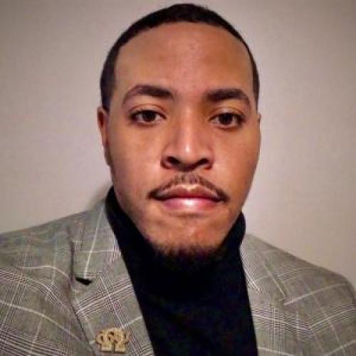 Headshot photo of Dominic Carter